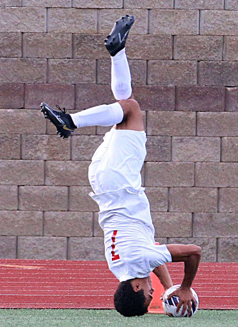 Timothy Christian's Nathan Canada rolls to throw in the ball in play against Wheaton Academy during the Class 1A State soccer third place game on Saturday, Oct. 29, 2022 at EastSide Centre in Peoria.