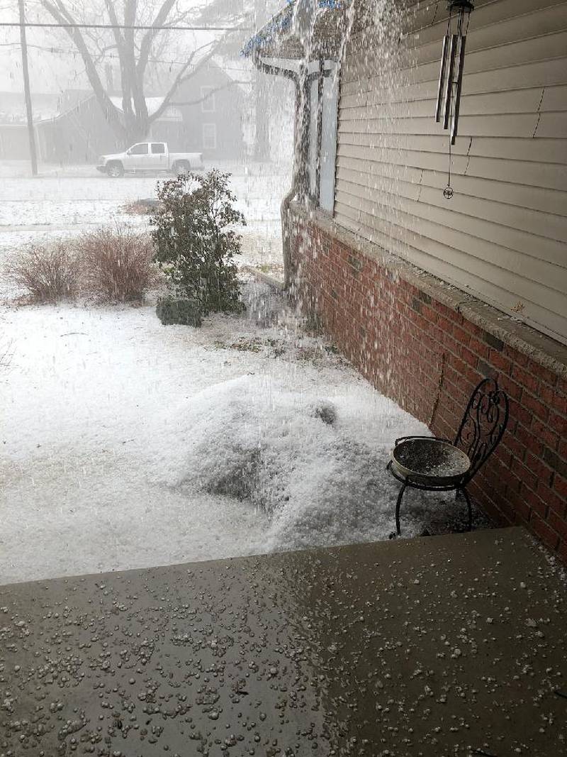 Hail piles up after an afternoon storm in Ogle County, Tuesday, April 4, 2023.