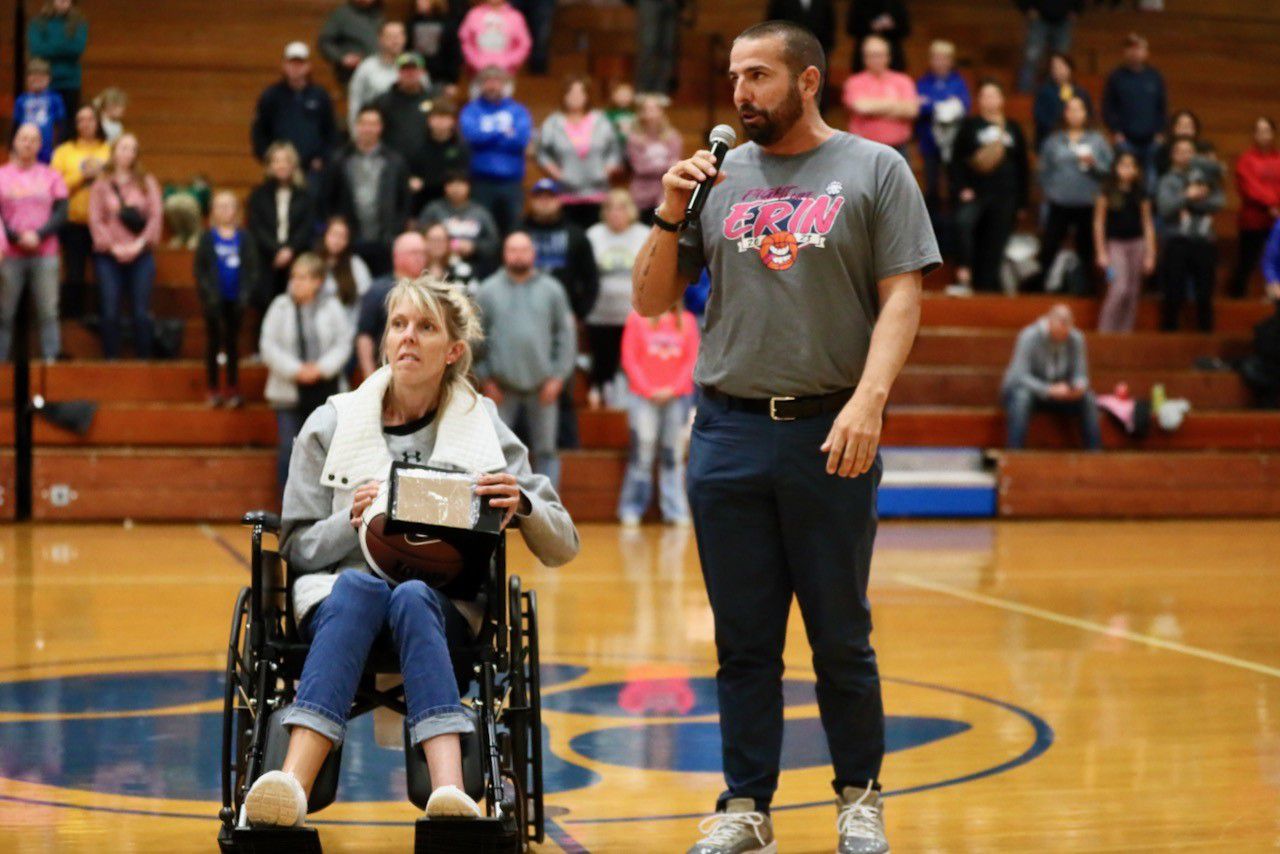 John and Erin Matlock, PES staff members, thank the crowd on the Fight like Erin Night Tuesday at Prouty Gym. Erin has a terminal neurological disease.