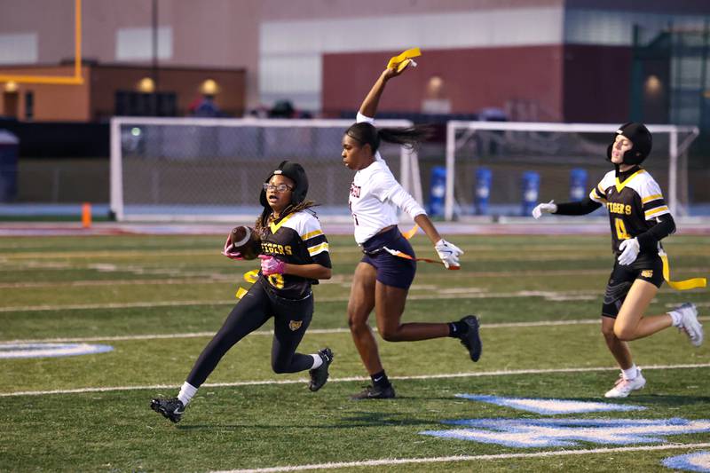 Oswego's Jazmin Hurston pulls the flag off of Joliet West's Londyn Clemons during the Panthers' 13-7 victory over Joliet West on Tuesday, Oct. 7, 2025.