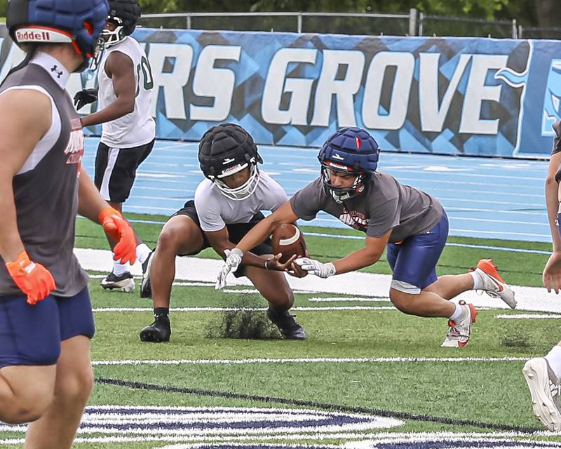 Plainfield Central's Kenyon Mollison makes a contested catch during the Downers Grove South 7 on 7 football tournament, July 12, 2025  in Downers Grove.