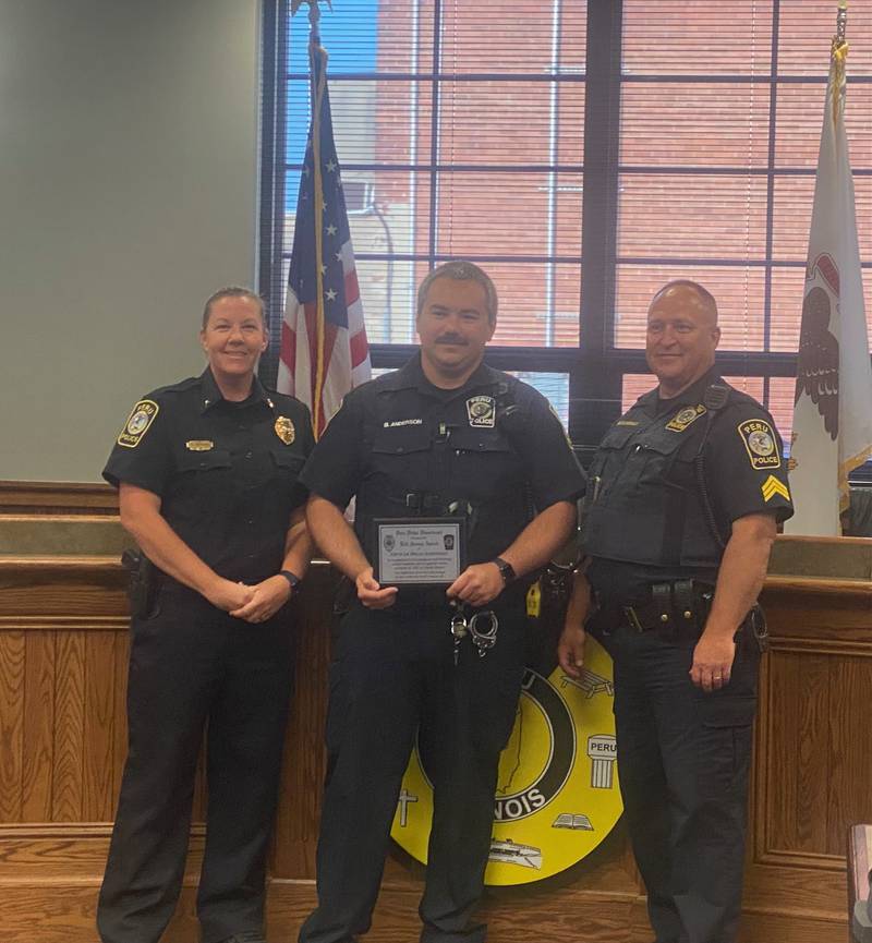 Peru Chief Sarah Raymond, Officer Bradley Anderson, and Sergeant Scott DeGroot after Anderson honored with a lifesaving award during Monday, June 5, 2023 city council meeting.