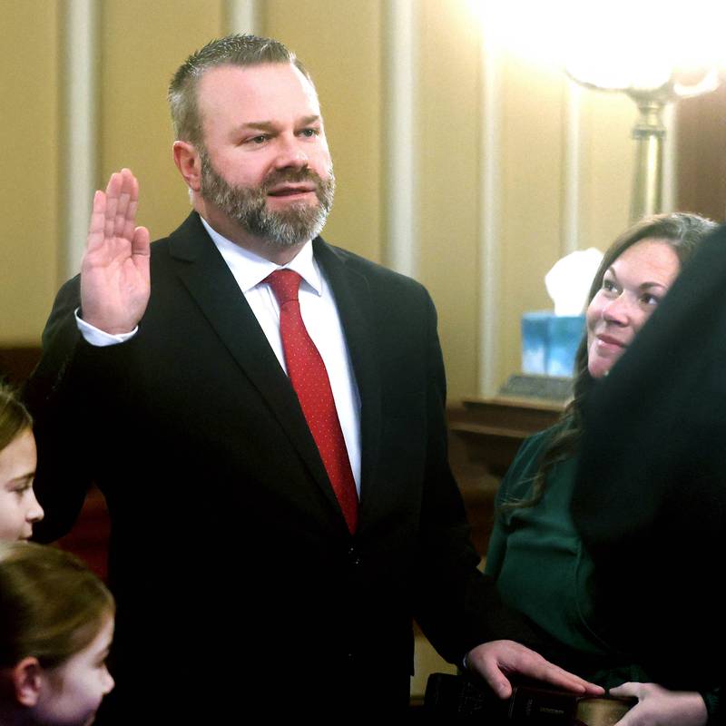 New DeKalb County State’s Attorney Riley Oncken, accompanied by his family, is sworn in by Chief Judge Bradley Waller Monday, Dec. 2, 2024, at the DeKalb County Courthouse in Sycamore.