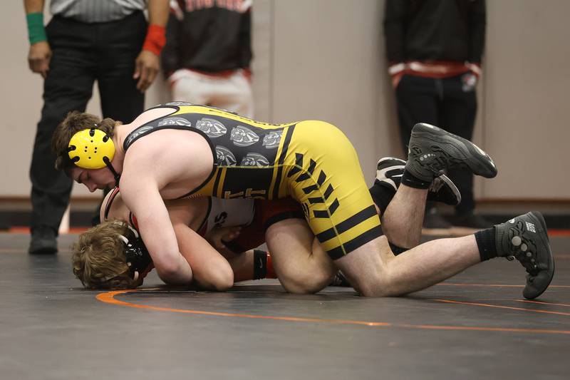 Joliet West’s Jacob Tyderek works over Plainfield North’s Jack Nowicki in the SouthWest Prairie Conference 215 pound championship on Saturday, Jan. 24, 2026 in Minooka.