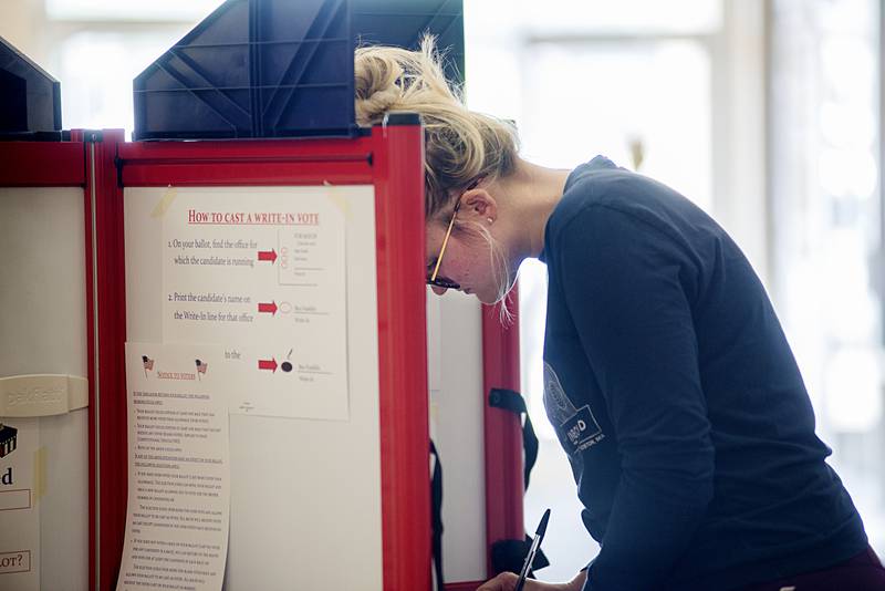 Martha Anderson of Sterling works to fill out her ballot Tuesday, June 28, 2022 at the mall in Sterling.