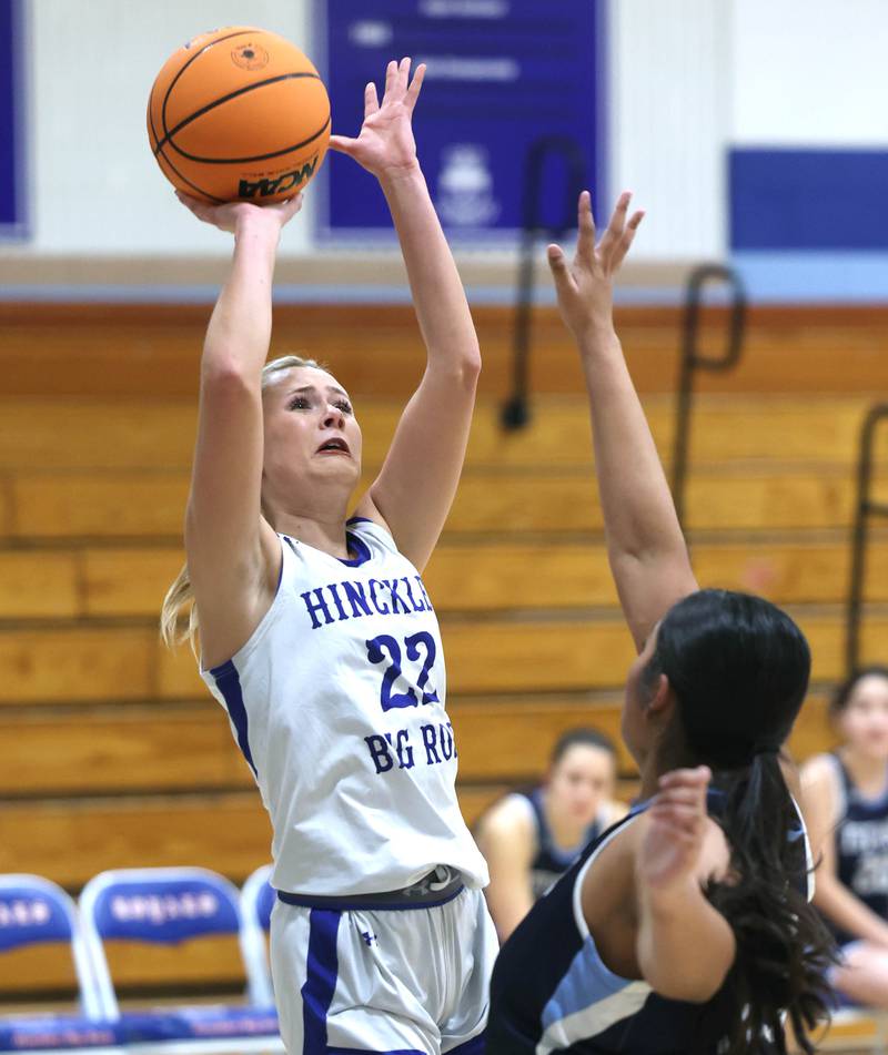 Hinckley-Big Rock's Anna Herrmann shoots over an Illinois Math and Science Academy defender during their game Thursday, Jan. 8, 2025, at Hinckley-Big Rock High School.