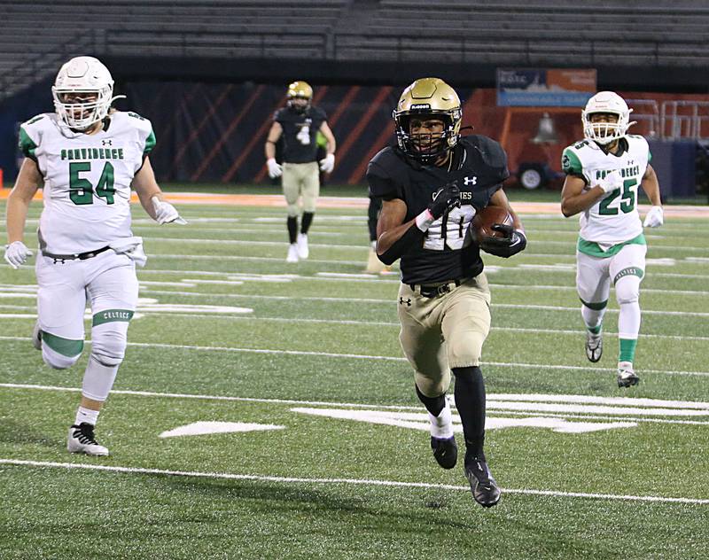 Sacred Heart-Griffin's J'veon Bardwell (10) sprints past Providence Catholic's Sean Dee (54) and teammate Rico Guillermo (25) on a run in the Class 4A state title on Friday, Nov. 25, 2022 at Memorial Stadium in Champaign.