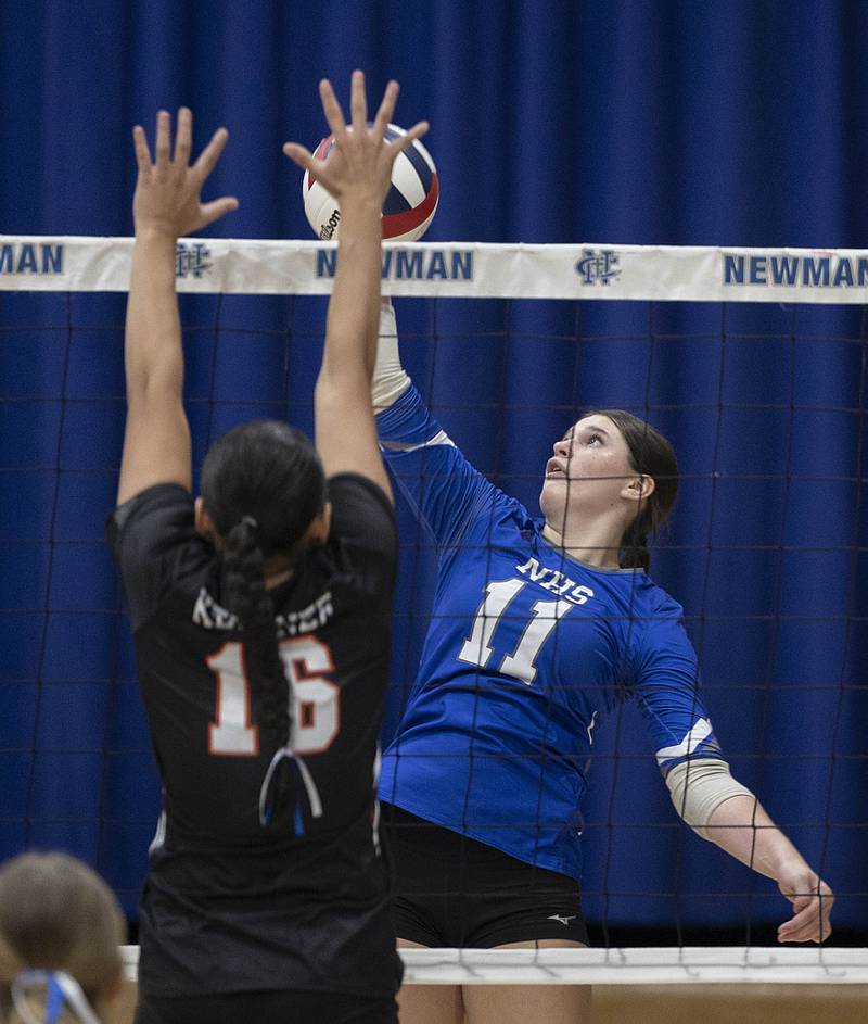 Newman’s Isabelle Lanning spikes against Kewanee Tuesday, Sept. 16, 2025.