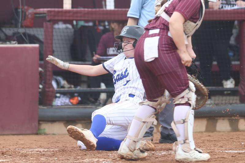 Lincoln-Way East’s Audrey Bullock slides home against Lockport on Monday, April 13, 2026 in Lockport.