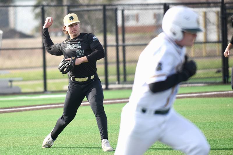 Bishop McNamara's Dom Panozzo, left, looks to throw Coal City's Ethan Olson out at first base during a game at Coal City Thursday, April 3, 2025.
