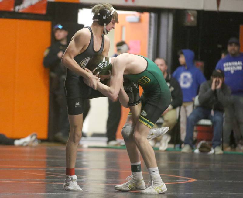 Sycamore's Michael Olson wrestles Geneseo's Landen Vincent in the 120 weight class during the Class 2A Sectional championship on Saturday, Feb. 15, 2025 at Washington High School.