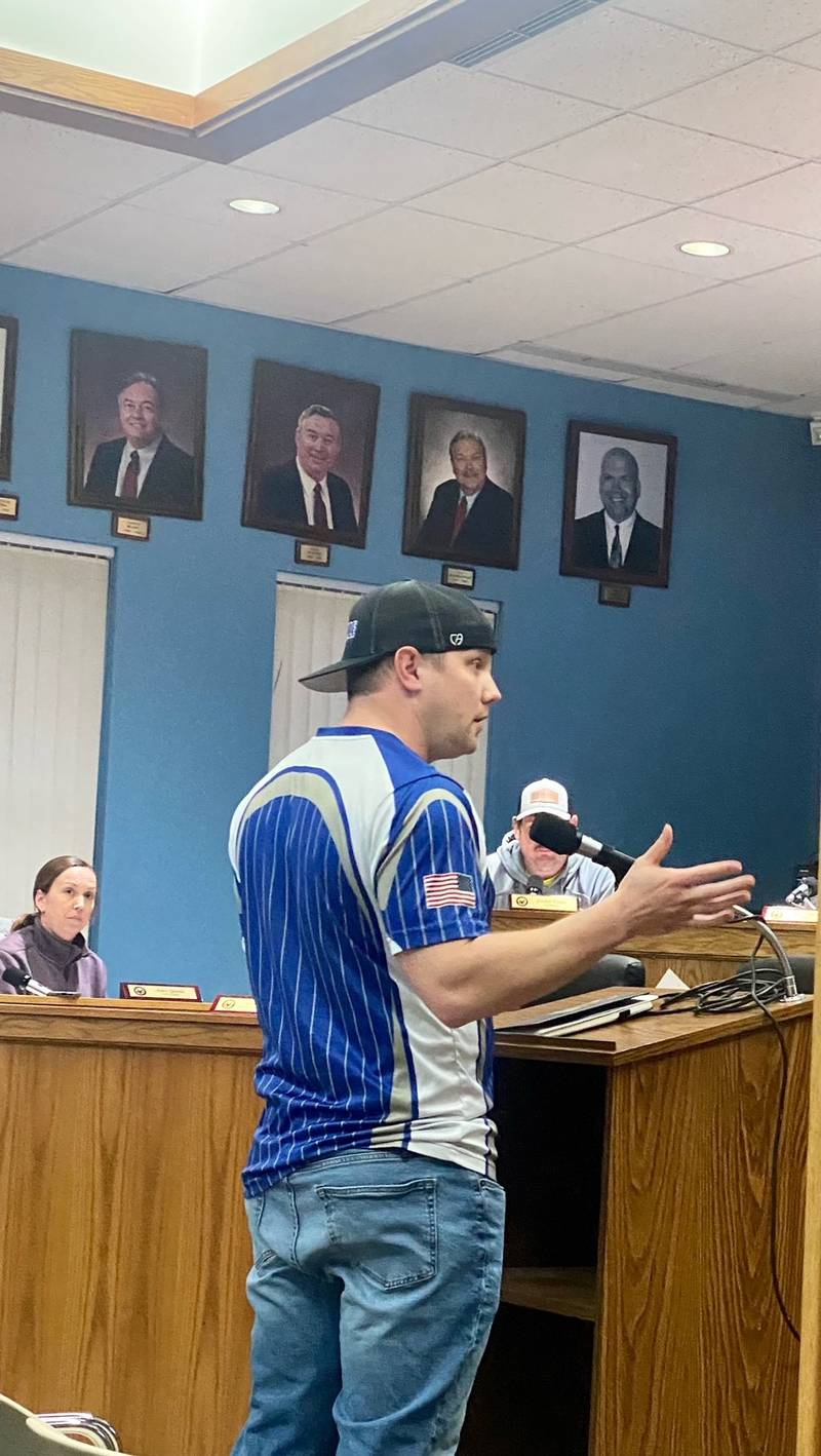 President of Baseball and Vice-President of Softball Josh Busche speaks during public comment safety concerns regarding the men’s softball league hitting balls into the little league field.