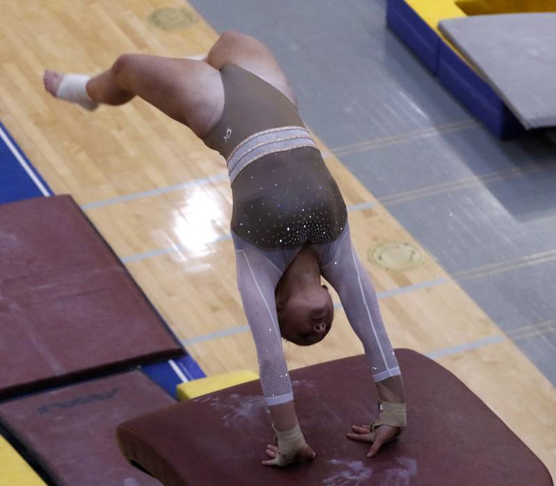 Carmel’s Alyssah Arends competes in the preliminary round of the vault on Friday, Feb. 21, 2025, during the IHSA Girls State Final Gymnastics Meet at Palatine High School.