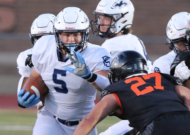 Plainfield South's Matthew Janiak looks to get by DeKalb’s Daniel Roman-Johnson during their game Friday, Sept. 1, 2023, at DeKalb High School.