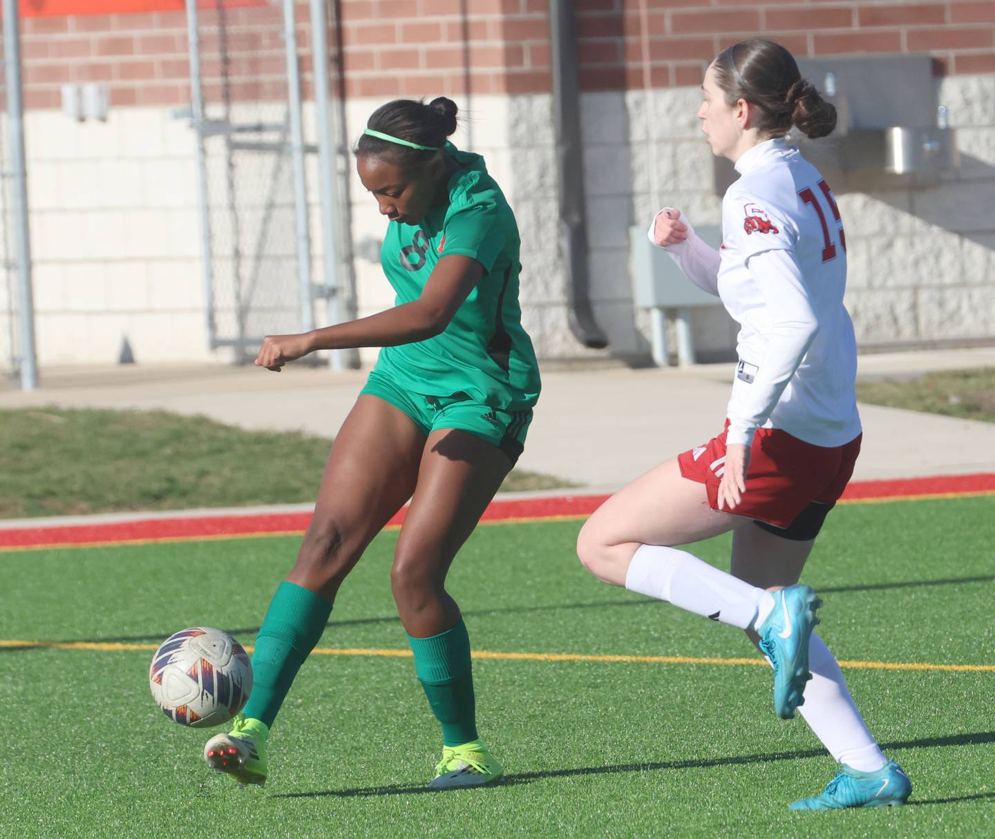 L-P's Kheyara Hunter kicks the ball past Streator's Aubrey Arambula on Friday, March 27, 2026 at the L-P athletic complex in La Salle.