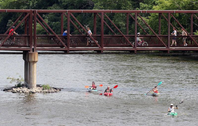 Kayakers make their way south on the Fox River in Batavia during 56th annual Mid-American Canoe and Kayak Race on June 4, 2017.