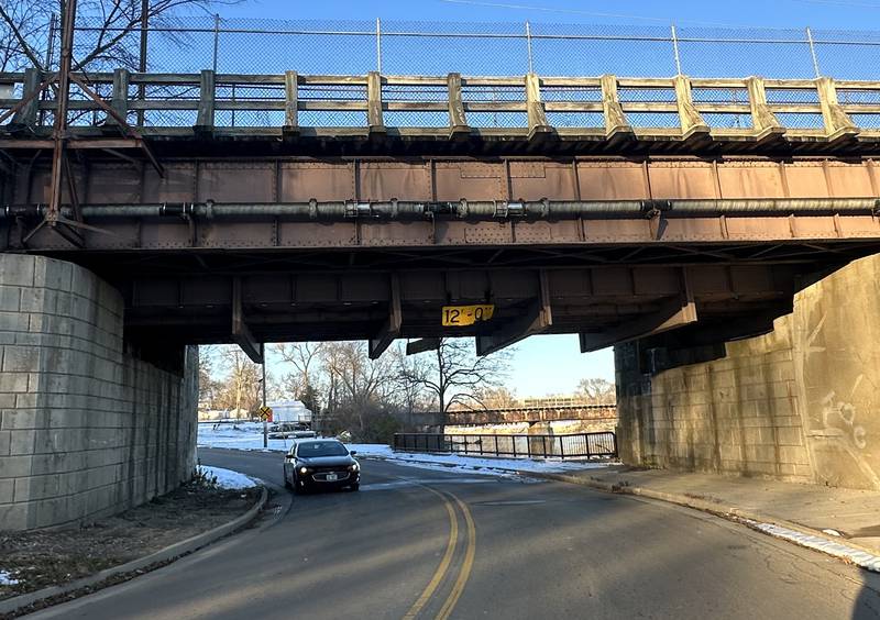 A motorist travels undeneath the Fox River Aqueduct that carries water from the Illinois and Michigan Canal above the Fox River has a 12 foot vertical clearance on Monday, Nov. 27, 2023 in Ottawa.