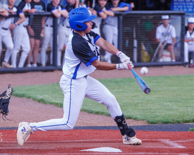St. Charles North's Nolan Macholz connect with a pitch against St. Charles East on Monday May 4, 2026 in St. Charles.