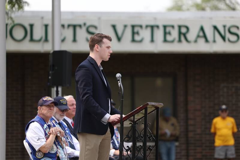 Thomas Morgan, Veterans and Military Outreach Aide, speaks on behalf of congresswoman Lauren Underwood at a special Flag Day ceremony dedicating a memorial to remember the 28 World War II Submarines that traveled through Joliet on their way to the Pacific theater in Bicentennial Park on Wednesday, June 14, 2023 in Joliet.