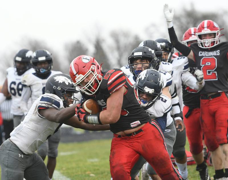 Forreston's Johnathen Kobler powers his way into the end zone as Quinten Frederick gives the touchdown signal during the Cardinals' 44-16 playoff win over Chicago Hope Academy on Saturday, Nov. 5.