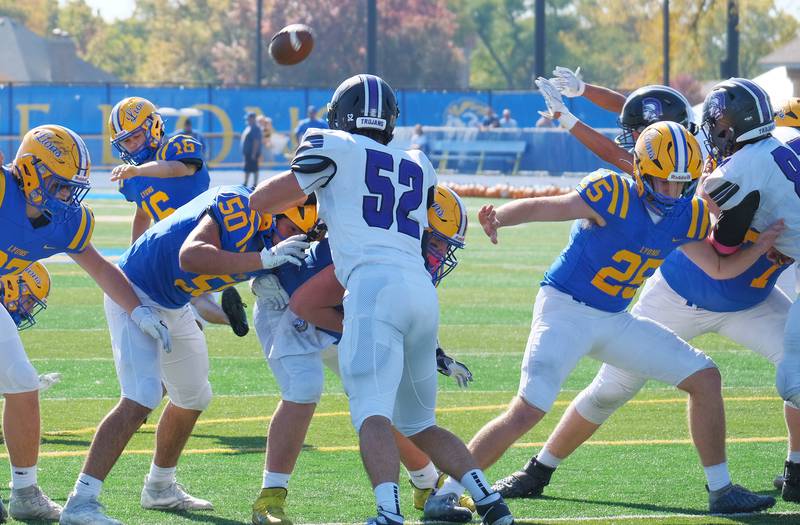 Lyons Township kicker David Waight (16) boots a field goal during a game against Downers Grove North on Oct. 22, 2022 at Lyons Township High School in LaGrange.