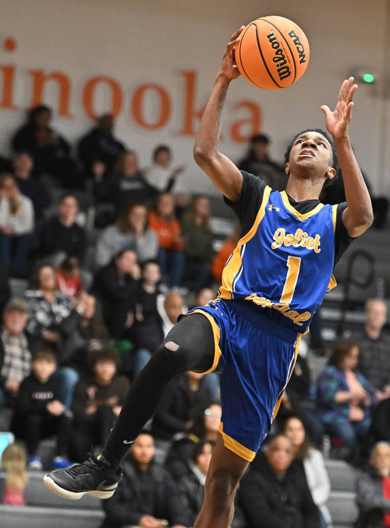 Joliet Central's Bernal Fox (1) goes up for a layup during a conference game against on Friday, Jan. 10, 2025, at Minooka.