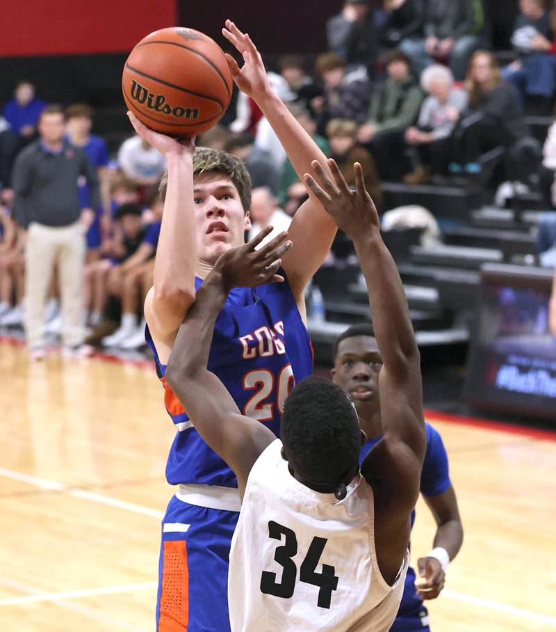 Genoa-Kingston's Nathan Skarzynski shoots over an Indian Creek defender Wednesday, Jan. 25, 2023, during their game at Indian Creek High School in Shabbona.