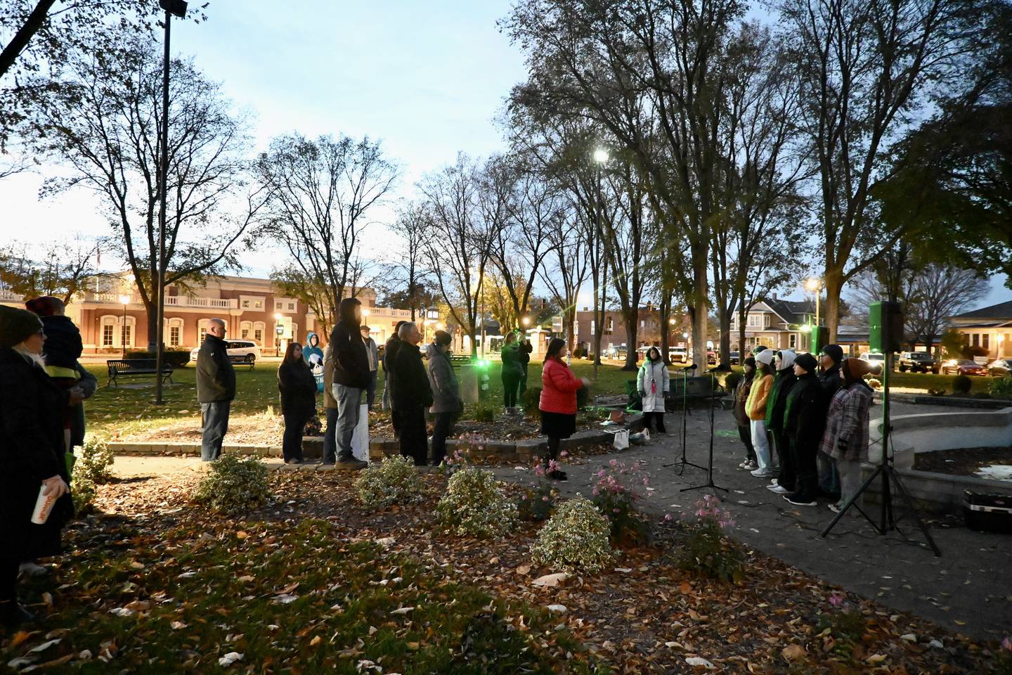 A crowd gathers to watch Ottawa High School Treble Choir perform three poems by Emily Dickinson, “Hope”, “Shade” and “Soul" on Wednesday, Nov. 1 for YSB's Light the Night.