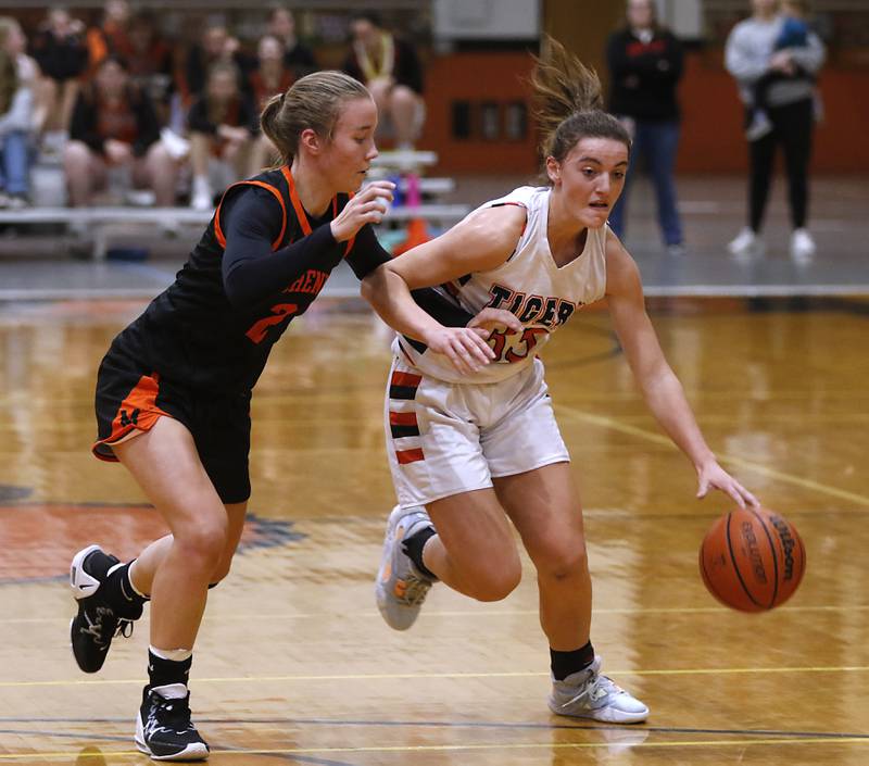 Crystal Lake Central's Kathryn Hamill, right, brings the ball up the court against McHenry's Emerson Gasmann, left, during a Fox Valley Conference girls basketball game Tuesday, Nov.. 29, 2022, between Crystal Lake Central and McHenry at Crystal Lake Central High School.