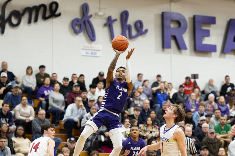 Plano's AJ Johnson (2) hangs in the air for a shot during Friday's Plano Christmas Classic semifinal.