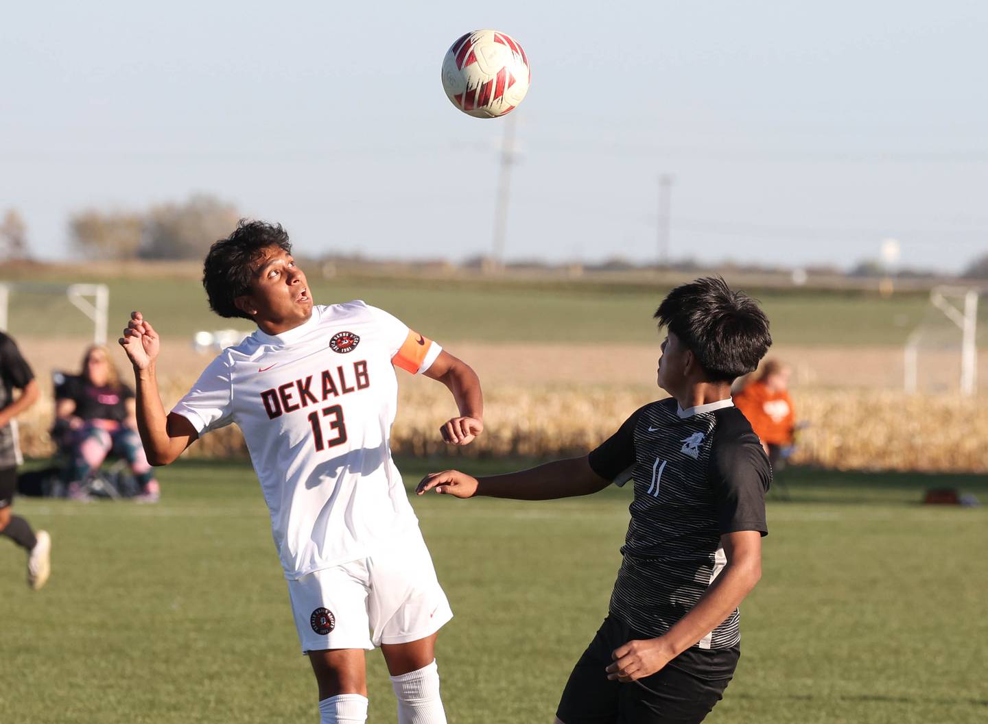 DeKalb's Henry Garcia-Alvarez gets ready to head the ball past Kaneland's Abe Paulino during their game Thursday, Oct. 17, 2024, at Kaneland High School in Maple Park.