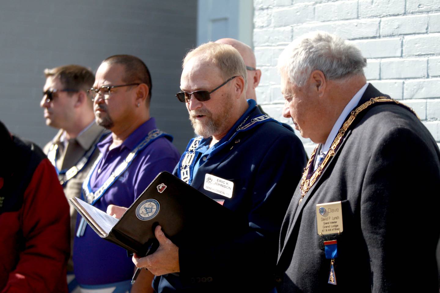 Eric Johnson of Geneva Masonic Lodge 139 speaks as  David Lynch, the Grand Master of The Most Worshipful Grand Lodge of Ancient Free and Accepted Masons of the State of Illinois, looks on during a ceremony on Friday, Oct. 25, 2024 in honor of the Geneva lodge’s 170th anniversary.