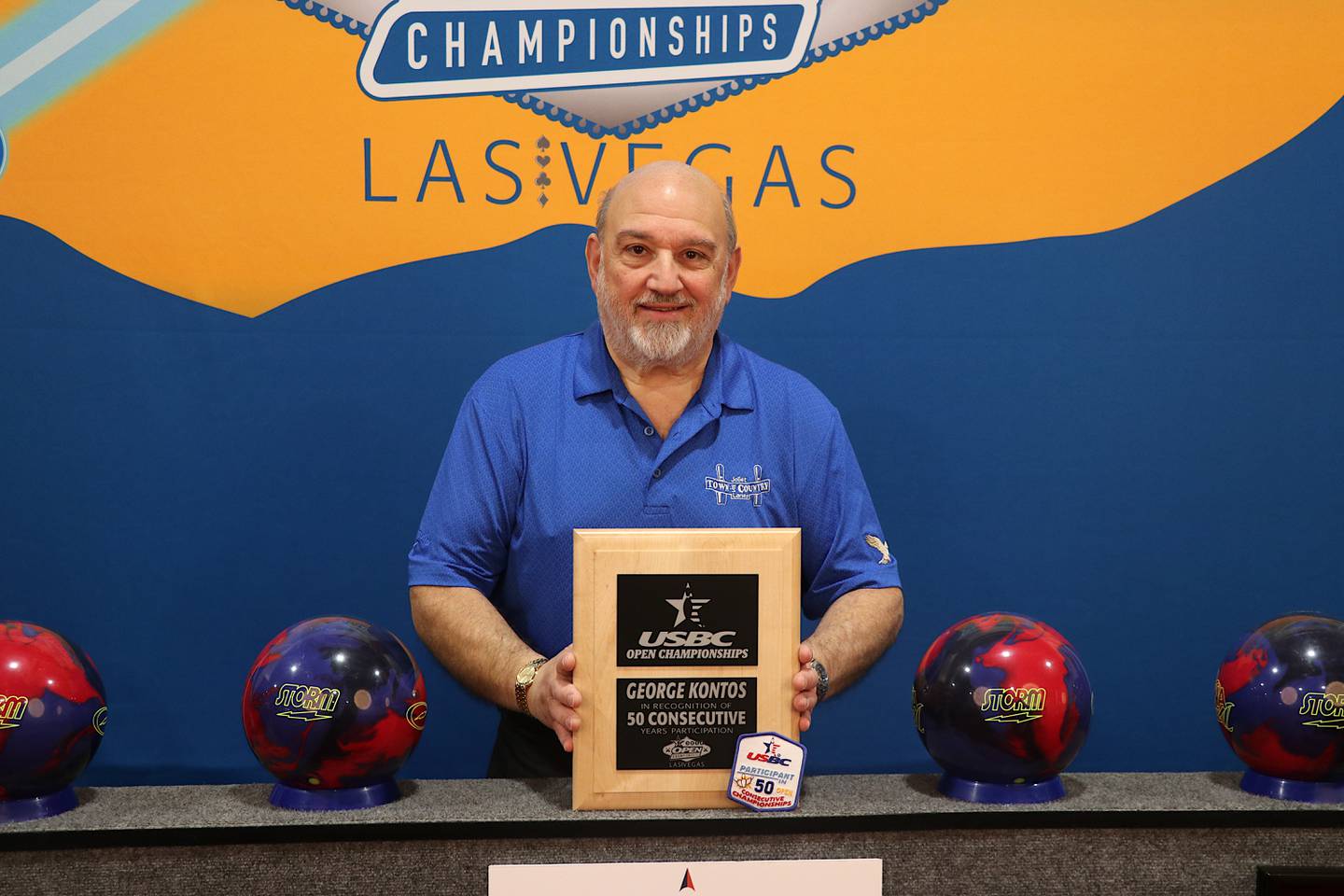 Joliet's George Kontos shows off the plaque he received for participating in the United States Bowling Congress Open Championships for the 50th year.