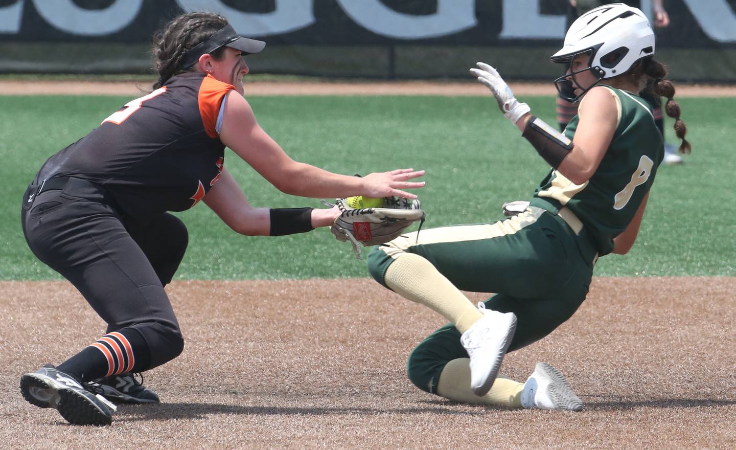 St. Bede's Lily Bosnich slides in under the tag of Illini Bluff's Zoe Eeten in the Class 1A State championship game on Saturday, June 3, 2023 at the Louisville Slugger Sports Complex in Peoria.