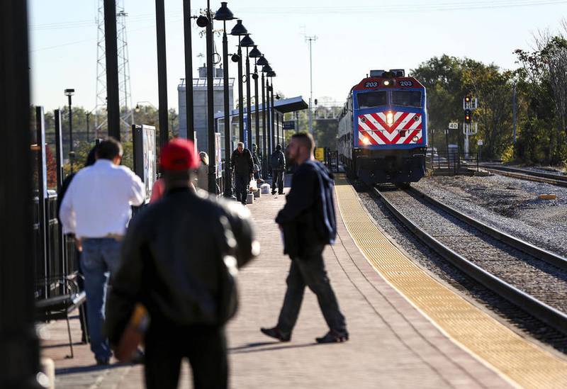 Train passengers wait for a Metra train to pull into the Joliet station in October in downtown Joliet. Joliet is making plans to rejuvenate efforts to build a new downtown train station.