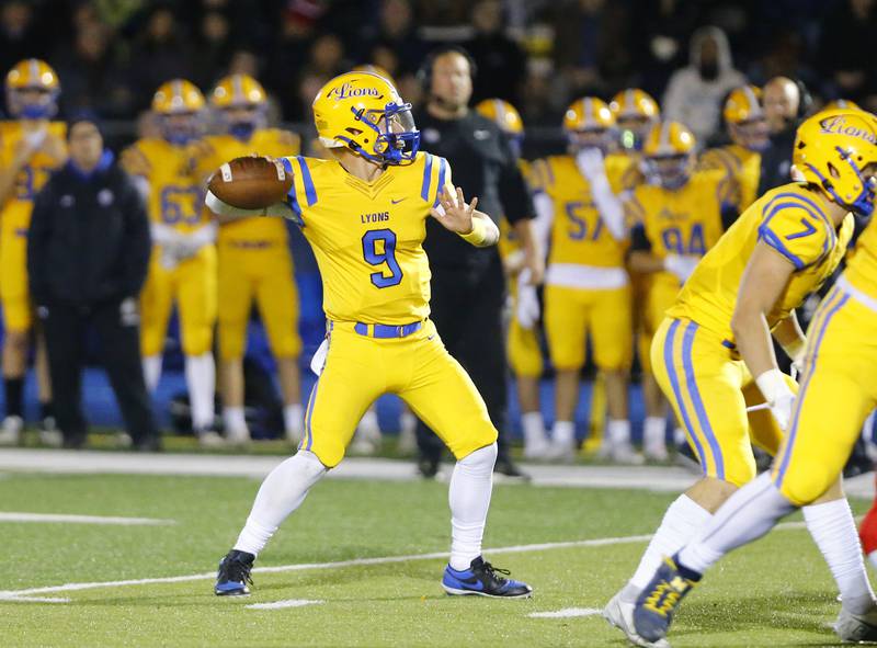 Lyons' Ryan Jackson (9) drops back to pass during a first round Class 8A varsity football playoff game between Lyons Township and Naperville Central on Friday, Oct. 28, 2022 in Western Springs, IL.