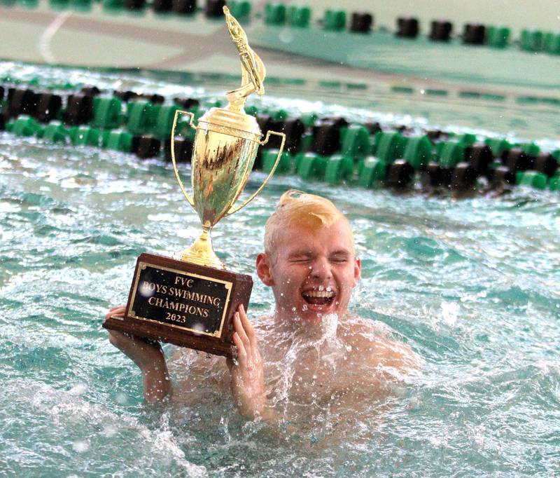 Cary-Grove co-op’s Dexter Zielinski celebrates after his team won the Fox Valley Conference Boys Swimming Invite at Woodstock North on Saturday.
