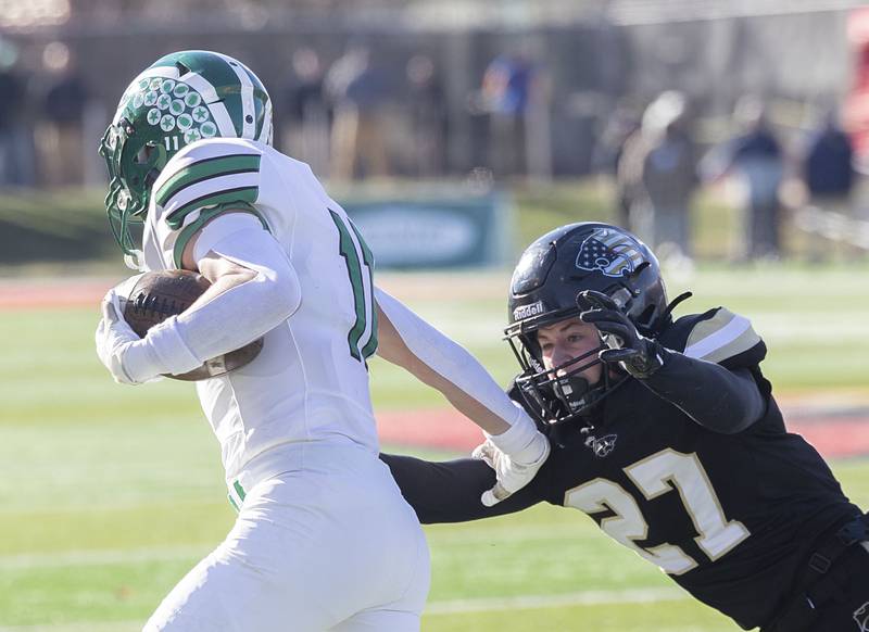 Lena-Winslow's Brody Cox eyes Brown County's Brodie Phelps for the tackle Friday, Nov. 28, 2025, in the Class 1A football finals at Hancock Stadium at ISU.