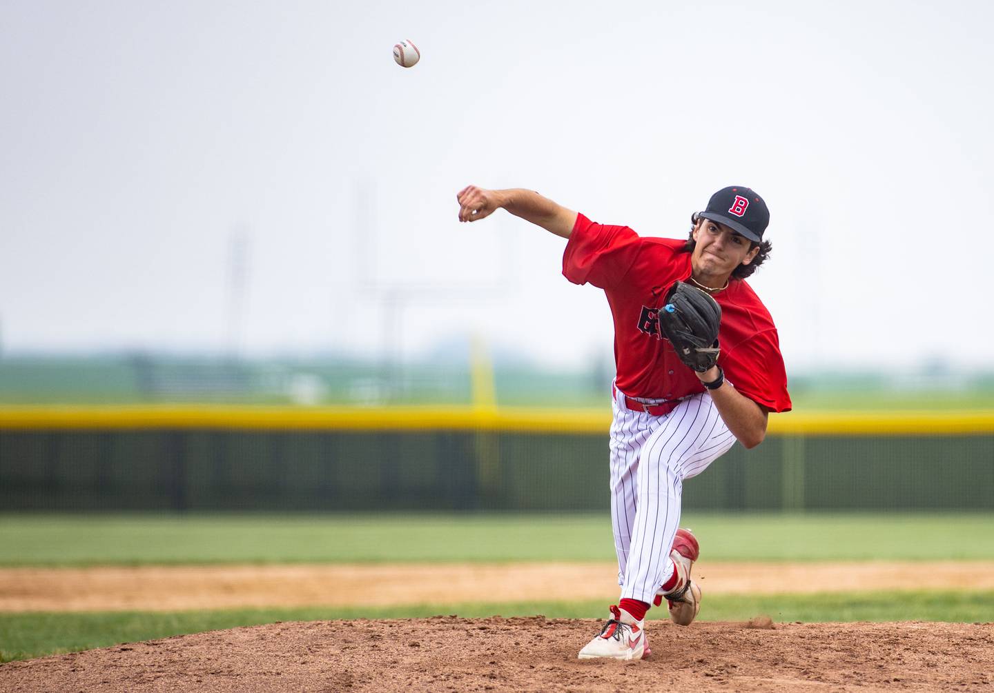 Benet Academy pitcher Gino Zagorac pitches during a game against St. Francis High School during the Class 3A Kaneland Sectional final at Kaneland High School in Maple Park on Saturday, June 7, 2025.