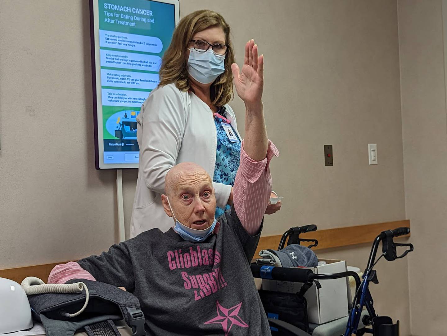 Libby Hall, 75, of Joliet, demonstrates the loss of her peripheral vision due to an aggressive brain cancer on Friday, Sept. 16, 2022, Joliet Oncology-Hematology Associates, while radiation oncology nurse Joan Quaresima looks on. Hall was diagnosed with glioblastoma multiform in 2020 and is currently wearing a device called Optune, which delivers an electrical field into the cancer cells in her brain.