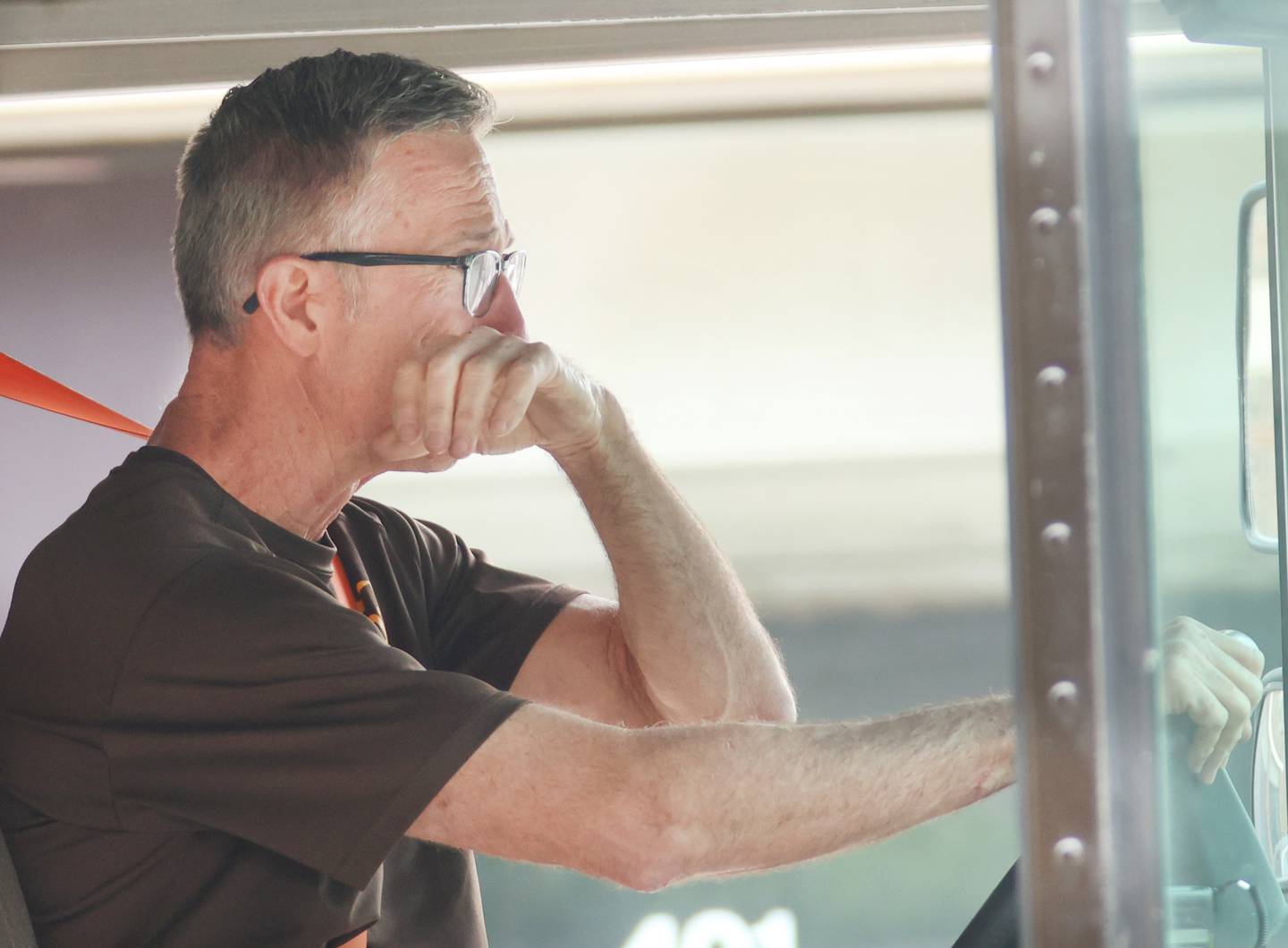 UPS driver Jim Bezley, gets emotional whle driving down Main Street  during his final delivery route on Friday, April 24, 2026 in Streator. Bezley is retiring from UPS after 47 years. Bezley began working for UPS right out of high school in 1979.