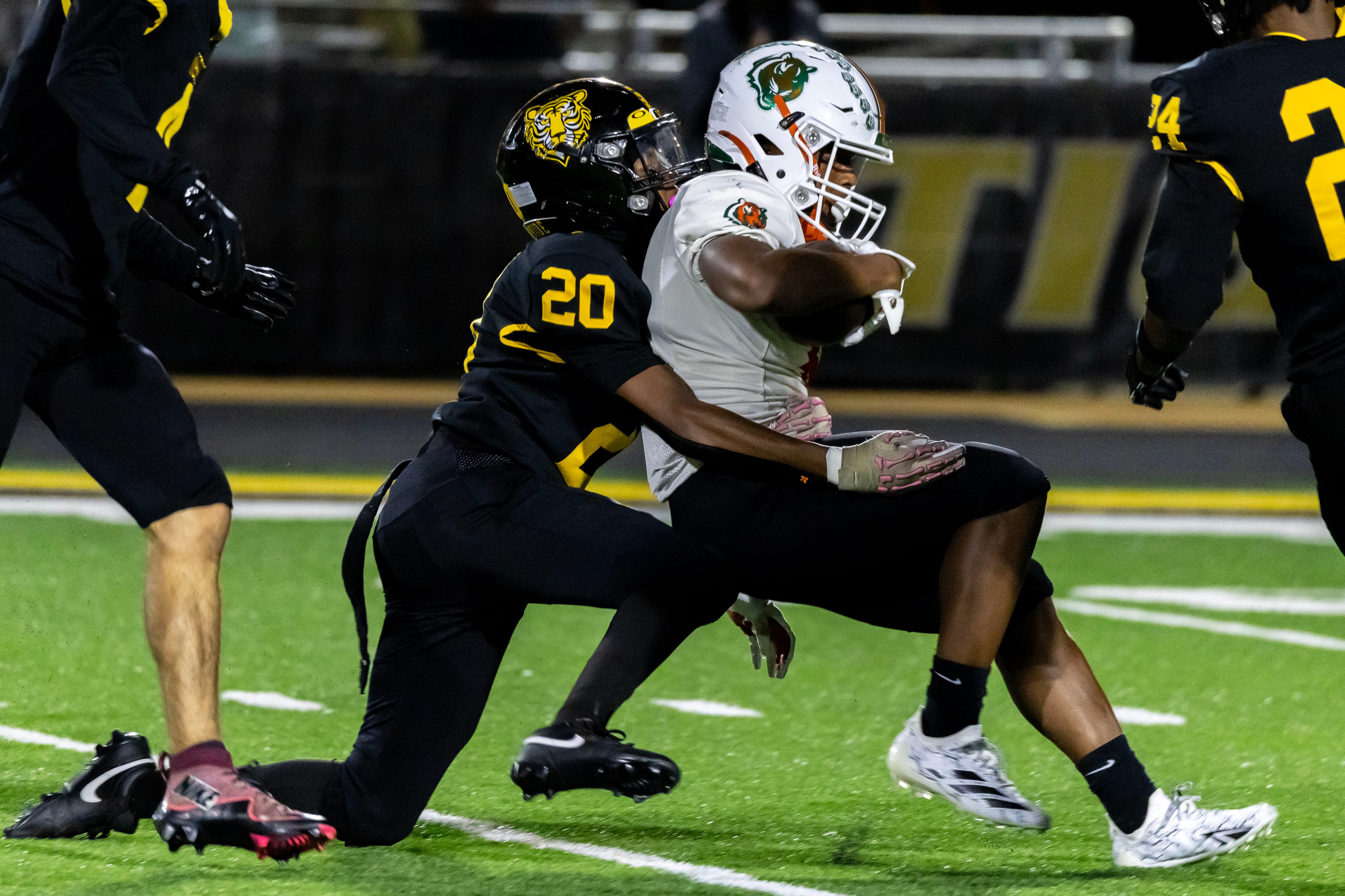 Joliet West's Marcus Jones tackles Plainfield East's David Croom during a varsity football game against at Joliet West.