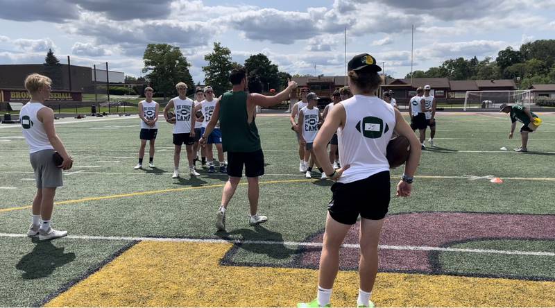 Northwest Missouri State starting quarterback Mike Hohensee providing instruction to Chicagoland area high school prospects at the Hohensee quarterback-wide receiver camp hosted at Montini High School on Saturday, July 30.