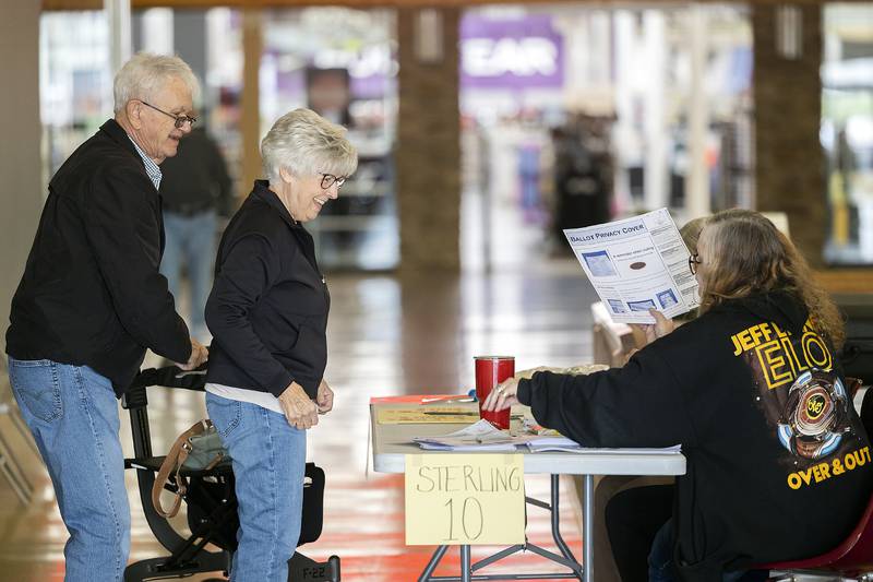 Ken and Barb Harrington grab a ballot Tuesday, April 1, 2025, at Northland Mall in Sterling during election day.