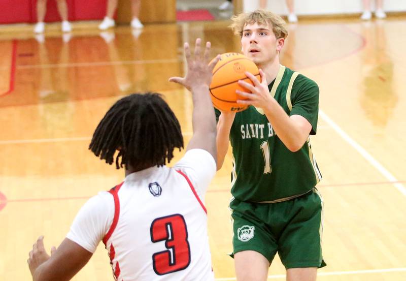 St. Bede's Kaden Newman eyes the hoop before taking a shot over LaMoille's Cody Winn on Tuesday, Feb. 11, 2025 at LaMoille High School.