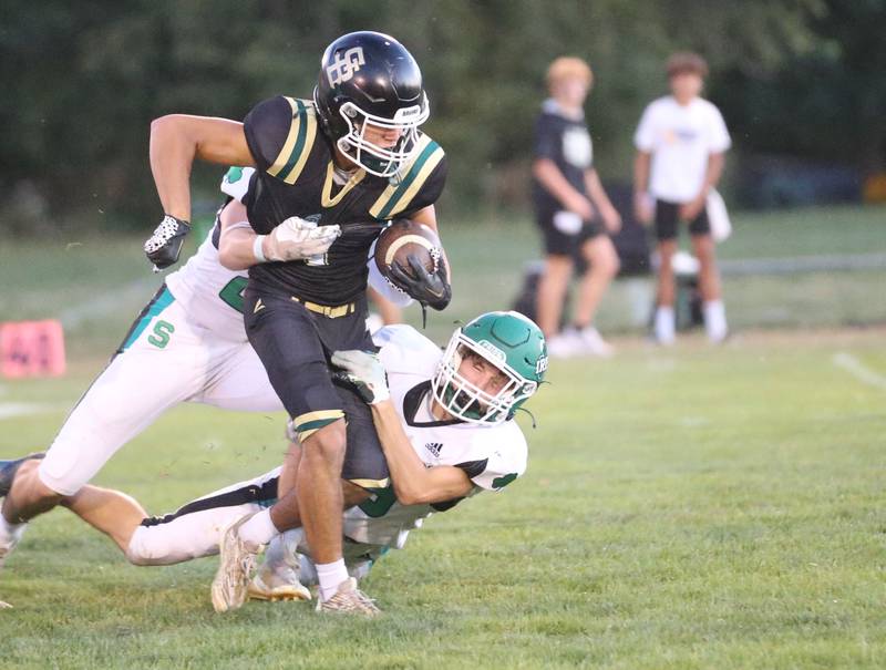 St. Bede's Jose DeLaTorre runs the ball as Seneca's Brady Sheedy and Travis Barr takes him down on Friday, Sept. 20, 2024 at St. Bede Academy.