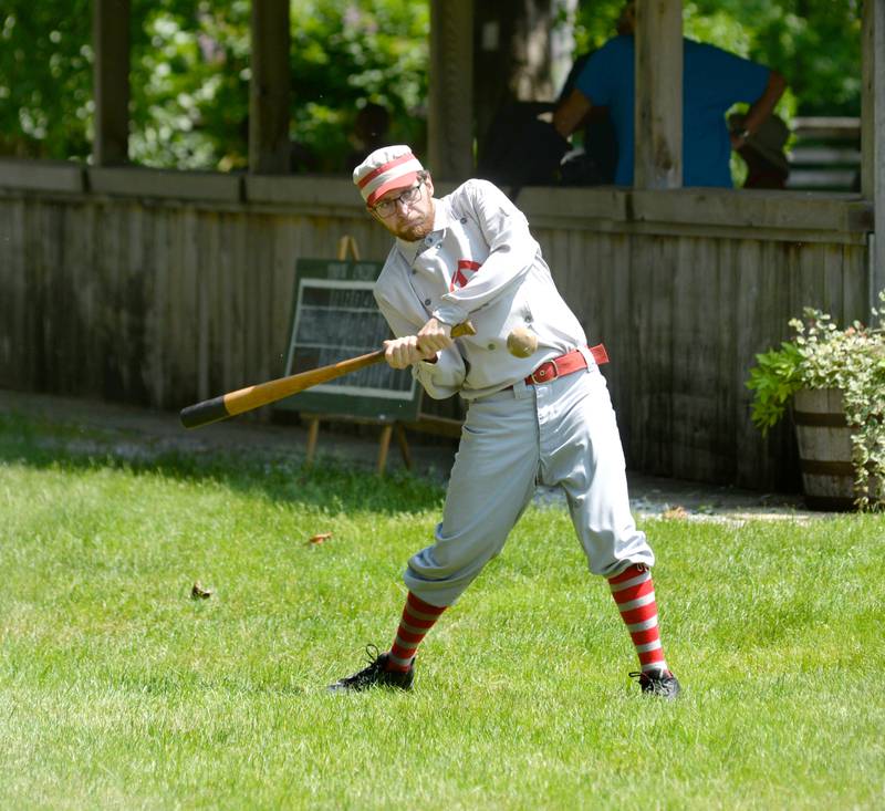 Garrison "Cannon" Thimmesch of Dixon watches a pitch as he bats for the Oregon Ganymedes Vintage Base Ball team during a game with the DuPage Plowboys on Saturday, June 3 at the John Deere Historic Site in Grand Detour.