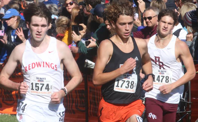 Benet Academy's Jacob Molloy (left) and Evan Gilleland compete in the Class 2A State Cross Country race on Saturday, Nov. 4, 2023 at Detweiller Park in Peoria.