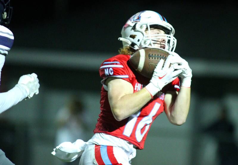 Marian Central’s Jacob Sievert hauls in a touchdown reception against Chicago Hope in varsity football at Woodstock Friday night