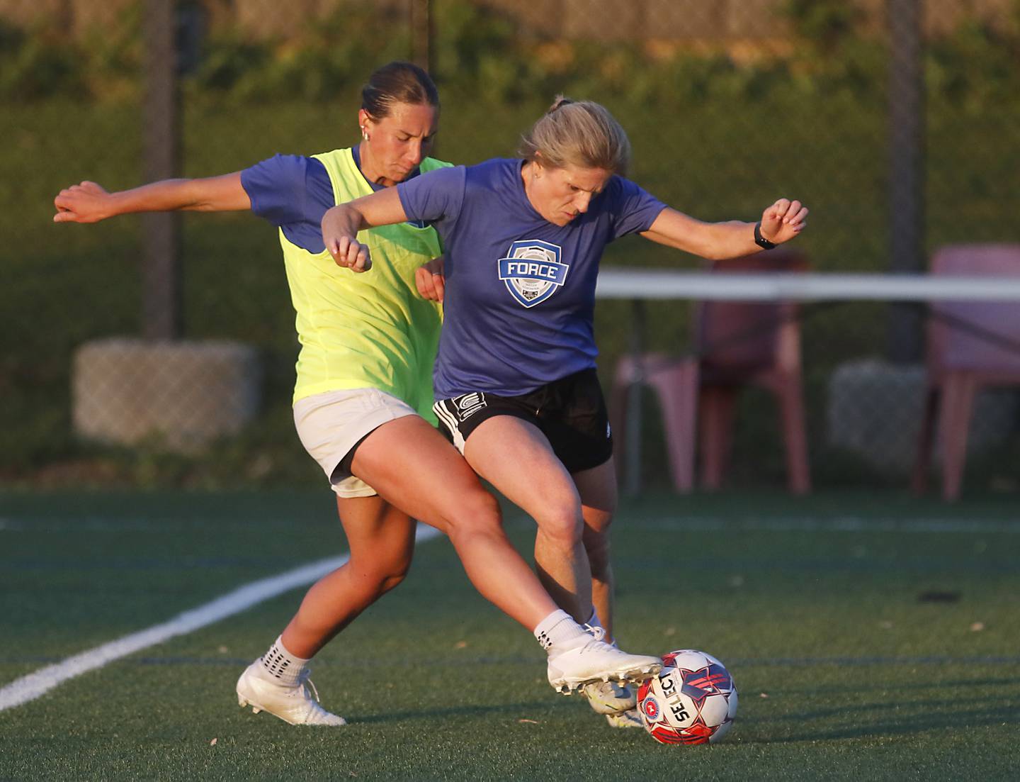 Crystal Lake Force players Kelly Collins and Stephanie Freund battle for control of the ball during practice for the semi-pro women's soccer team on Friday, May 23, 2025, at the MAC sports center in Crystal Lake. The Force is playing in the United Women’s Soccer league and his its first game on Saturday against Edgewater Castle Football Club.